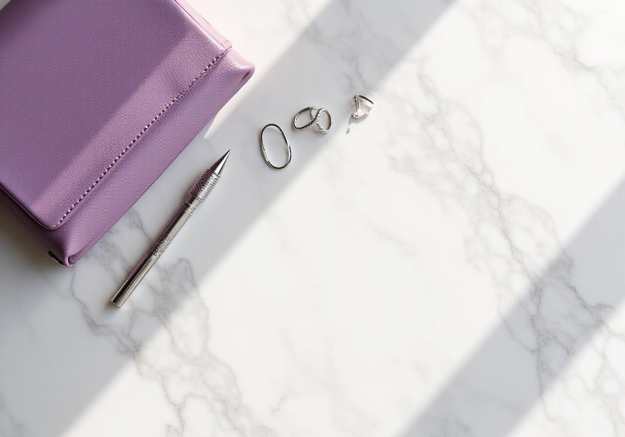 Artisanal jewelry and architectural blueprints on a clean desk